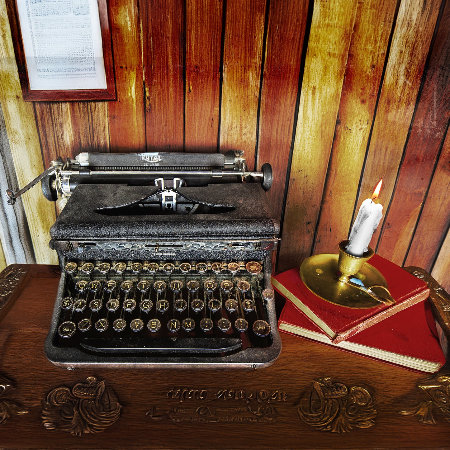 Vintage Royal Typewriter on a Desk with Vintage Books by Candlelight